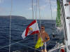 Marquesas Passage - Jan hoists courtesy and Q flags - 91K